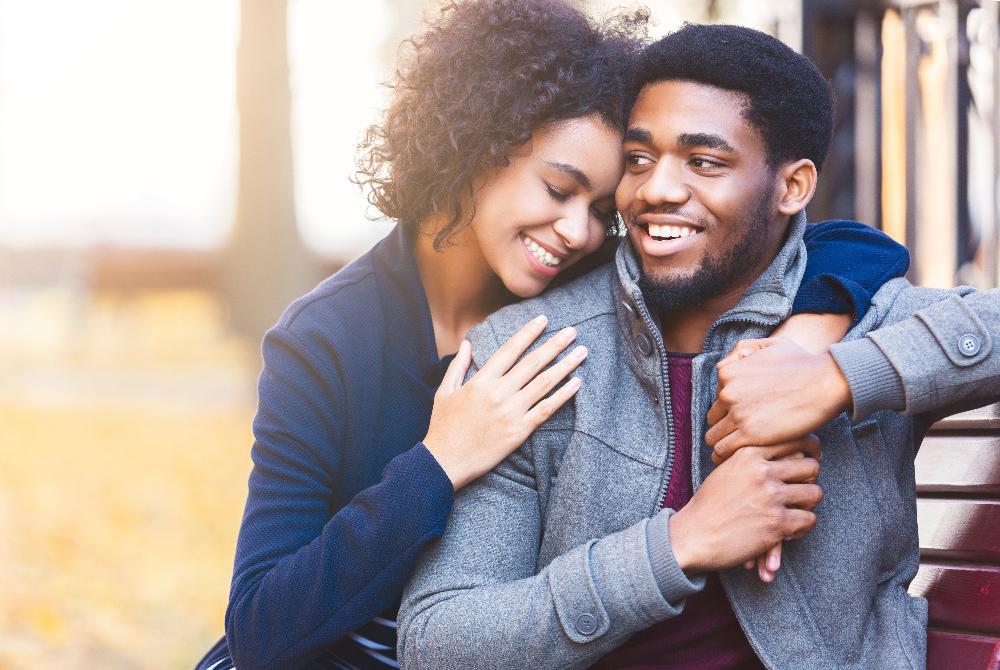 young couple hugging outside | cosmetic dentist allentown pa