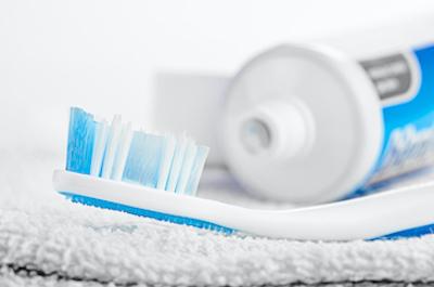 An image of a toothbrush and toothpaste