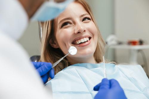 woman smiling in dental exam | allentown dentist