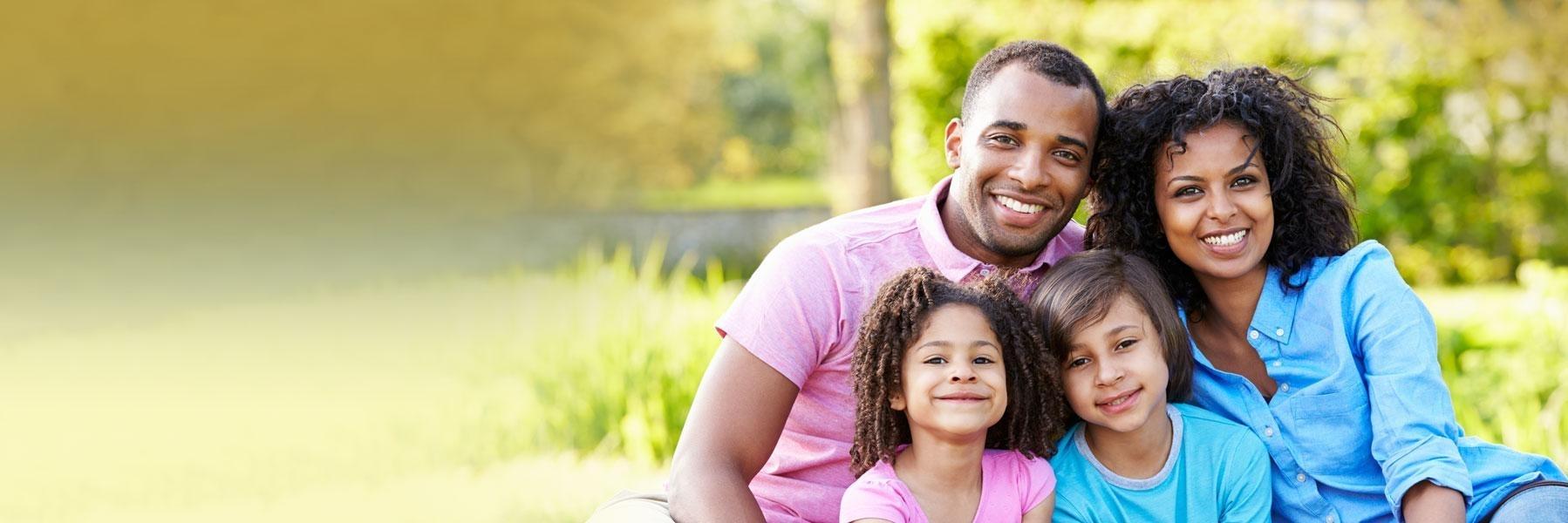 family of three smiling & hugging l dentist allentown pa
