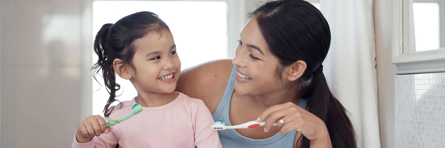 mother brushing teeth with daughter | dentist allentown pa