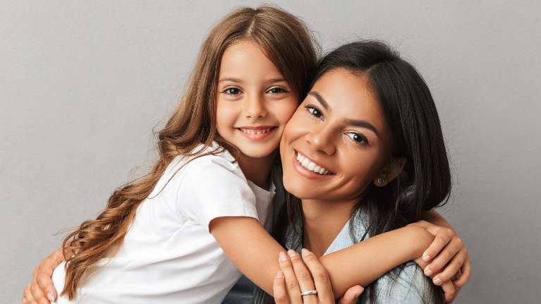 A smiling mother and daughter | family dentist