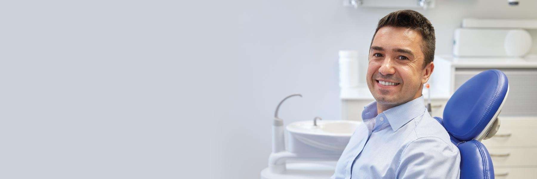A smiling man at the dentist's office 