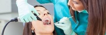 woman receiving dental exam l cosmetic dentist allentown pa