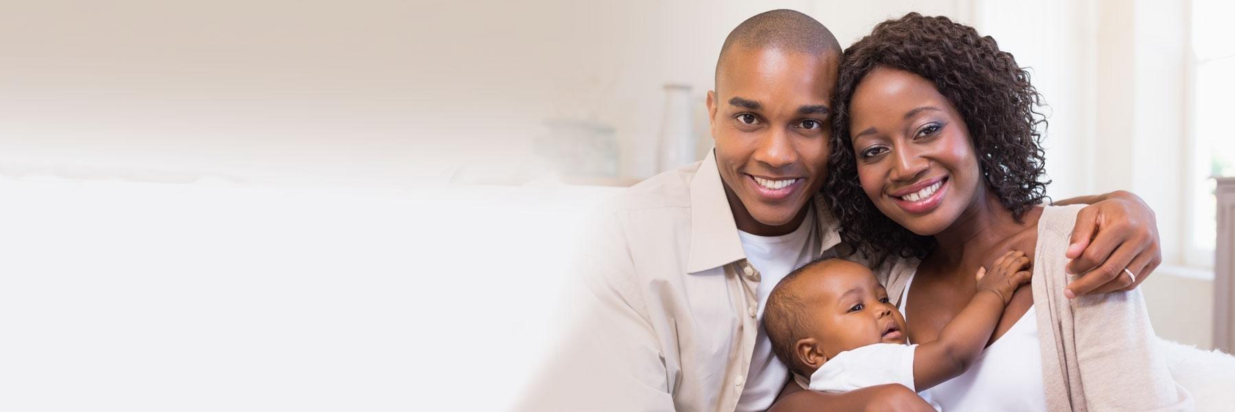 young family of three hugging | periodontal treatment allentown